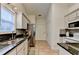 Well-lit kitchen features stainless steel appliances, granite countertops, and decorative backsplash at 2220 Lily Valley Dr, Lawrenceville, GA 30045