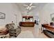 Spacious living room with tile floors, high ceilings, neutral walls, and a view into other rooms at 2220 Lily Valley Dr, Lawrenceville, GA 30045