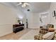 Inviting living room with tile floors, high ceilings, neutral walls, and tastefully arranged furniture at 2220 Lily Valley Dr, Lawrenceville, GA 30045