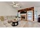 Spacious living room features a fireplace and a comfortable sectional sofa at 2220 Lily Valley Dr, Lawrenceville, GA 30045