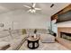 Comfortable living room showcases a fireplace and a large sectional sofa at 2220 Lily Valley Dr, Lawrenceville, GA 30045