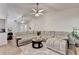 Open-concept living room features a sectional sofa and neutral color palette at 2220 Lily Valley Dr, Lawrenceville, GA 30045