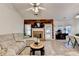 Inviting living room boasts a beautiful brick fireplace and a comfortable sectional sofa at 2220 Lily Valley Dr, Lawrenceville, GA 30045