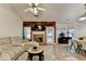 Bright living room showcasing a fireplace, comfortable seating, and seamless flow into the dining area at 2220 Lily Valley Dr, Lawrenceville, GA 30045