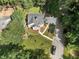 An aerial view of a home with a beautifully landscaped yard and long driveway at 2249 Beecher Sw Rd, Atlanta, GA 30311
