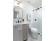 Modern bathroom with white cabinets, stone countertop, and glass enclosed shower at 2249 Beecher Sw Rd, Atlanta, GA 30311