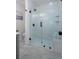 Modern bathroom with an enclosed glass shower and white vertical tiling at 2249 Beecher Sw Rd, Atlanta, GA 30311