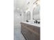 Bathroom with double sinks, modern mirrors, and gray vanity at 2249 Beecher Sw Rd, Atlanta, GA 30311