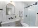 Bathroom with white cabinets, stone countertop, and glass enclosed shower at 2249 Beecher Sw Rd, Atlanta, GA 30311
