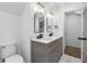 Modern bathroom with double vanity and black hardware at 2249 Beecher Sw Rd, Atlanta, GA 30311