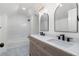 Bathroom with double sinks, black faucets, and modern mirrors at 2249 Beecher Sw Rd, Atlanta, GA 30311