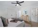 Bedroom with tray ceiling, dark ceiling fan, and en suite bathroom with shower at 2249 Beecher Sw Rd, Atlanta, GA 30311