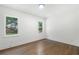Bedroom with hardwood floors, trim and baseboards, and abundant natural light at 2249 Beecher Sw Rd, Atlanta, GA 30311