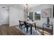 Bright dining room featuring a wooden table, black chairs, and stylish decor at 2249 Beecher Sw Rd, Atlanta, GA 30311