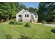 Beautifully landscaped front yard with lush green grass and a charming, updated home at 2249 Beecher Sw Rd, Atlanta, GA 30311