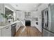 Bright kitchen featuring stainless steel appliances, quartz countertops, and white cabinetry at 2249 Beecher Sw Rd, Atlanta, GA 30311