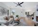 Bright living room featuring hardwood floors, neutral decor, and an open floor plan at 2249 Beecher Sw Rd, Atlanta, GA 30311