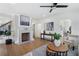 Bright living room features a decorative fireplace, hardwood floors, and modern decor at 2249 Beecher Sw Rd, Atlanta, GA 30311