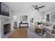 Cozy living room featuring a brick fireplace, hardwood floors and neutral decor at 2249 Beecher Sw Rd, Atlanta, GA 30311