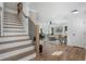 Open concept living room featuring hardwood floors and stairs at 2249 Beecher Sw Rd, Atlanta, GA 30311