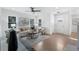 Open concept living room featuring hardwood floors, neutral decor, and modern ceiling fan at 2249 Beecher Sw Rd, Atlanta, GA 30311