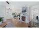 Open concept living room with hardwood floors, white walls, and access to dining area at 2249 Beecher Sw Rd, Atlanta, GA 30311