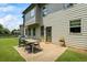 Outdoor patio with a grill and dining set, perfect for entertaining in the expansive backyard at 4275 Hunters Walk Way, Cumming, GA 30028