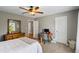 Bedroom with neutral colored walls, and a dark wood desk at 4275 Hunters Walk Way, Cumming, GA 30028