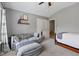 Bedroom with grey walls, couch, and an exterior view at 4275 Hunters Walk Way, Cumming, GA 30028