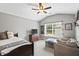 Bedroom with grey walls, ceiling fan, and backyard view at 4275 Hunters Walk Way, Cumming, GA 30028
