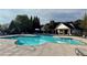 Sparkling community pool with lounge chairs for relaxation and a covered picnic area at 4275 Hunters Walk Way, Cumming, GA 30028