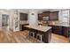 Spacious kitchen with an island, stainless steel appliances, granite countertops, and plenty of cabinet storage at 4275 Hunters Walk Way, Cumming, GA 30028
