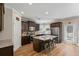 Bright kitchen with dark cabinets, stainless appliances, kitchen island with barstool seating, and breakfast nook at 4275 Hunters Walk Way, Cumming, GA 30028