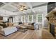 Bright and open living space with a fireplace, natural light, comfortable seating, and modern finishes at 4275 Hunters Walk Way, Cumming, GA 30028