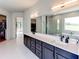 Beautiful bathroom showcasing dual sinks, modern lighting, and a separate shower area at 2900 Waterford Dr Sw, Conyers, GA 30094
