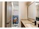 Bright bathroom with a granite countertop, modern sink, and a charming whale themed shower curtain, perfect for children at 2900 Waterford Dr Sw, Conyers, GA 30094