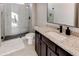 Modern bathroom features a glass-enclosed shower, granite countertop, and dark wood cabinets at 2900 Waterford Dr Sw, Conyers, GA 30094