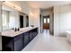 Gorgeous bathroom featuring dual vanities, a soaking tub, and a separate shower at 2900 Waterford Dr Sw, Conyers, GA 30094
