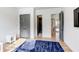 Bright bedroom showcasing hardwood floors, a comfortable beanbag, and a doorway view to other rooms in the house at 2900 Waterford Dr Sw, Conyers, GA 30094