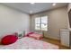 Bright bedroom with a toddler bed, soft rug, and ample natural light, creating a cozy and comfortable space for a young  at 2900 Waterford Dr Sw, Conyers, GA 30094