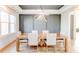 Dining room featuring a wood table, stylish chairs, and contemporary lighting at 2900 Waterford Dr Sw, Conyers, GA 30094