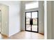 Welcoming entryway featuring a modern black-framed glass door and bright, neutral decor at 2900 Waterford Dr Sw, Conyers, GA 30094