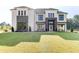 Beautiful new construction home with a lawn, stone accents, and modern windows at 2900 Waterford Dr Sw, Conyers, GA 30094