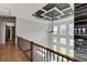 Bright hallway with a view of the living room below and modern lighting at 2900 Waterford Dr Sw, Conyers, GA 30094