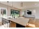 Bright open kitchen features a large island with a sink, dishwasher and large windows to the back yard at 2900 Waterford Dr Sw, Conyers, GA 30094