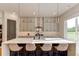 Gourmet kitchen with large island, stainless appliances, quartz countertops and custom cabinets at 2900 Waterford Dr Sw, Conyers, GA 30094