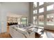 Open floor plan with kitchen and living area featuring comfortable couch and large windows at 2900 Waterford Dr Sw, Conyers, GA 30094