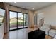 Light-filled living room with large windows showcasing the backyard view and an adjacent staircase at 2900 Waterford Dr Sw, Conyers, GA 30094
