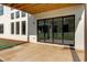 Covered patio with floor to ceiling sliding glass doors and brick exterior at 2900 Waterford Dr Sw, Conyers, GA 30094