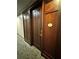 Apartment front door with dark wood finish, number 211, and decorative paneling at 77 Peachtree Ne Pl # 211, Atlanta, GA 30309